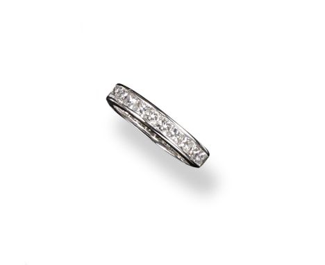 A diamond full circle eternity ring, the square~shaped diamonds weigh approximately 2.80cts in total. Size L.