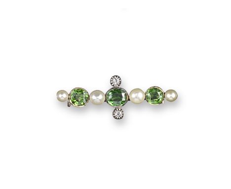 A demantoid garnet and pearl bar brooch, the three oval shaped demantoid garnets alternately set with pearls, the central sto