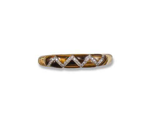 A tiger's eye and diamond set bangle, the triangular tiger's eye cabochons are set within a zig-zagged line of circular-cut d