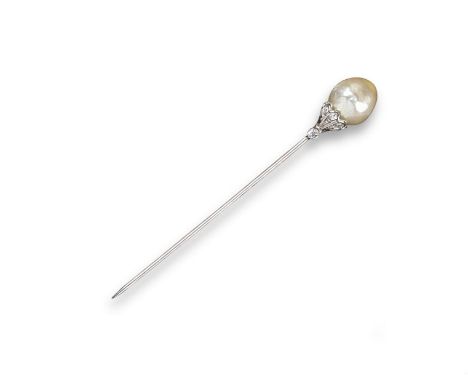 A natural pearl and diamond set stick pin, the pearl sits on a cap set with small diamonds. With box.Accompanied by report nu