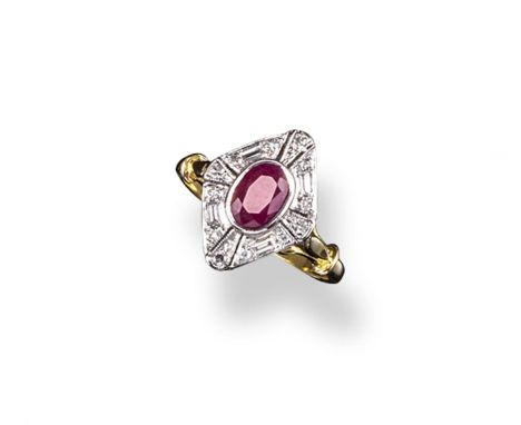 A ruby and diamond cluster ring, the oval~shaped ruby is set within a surround of circular and baguette~shaped diamonds in ye