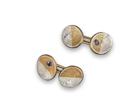 A pair of yellow and white textured gold oval~shaped cufflinks, each link set with a cushion~shaped diamond or a circular~cut