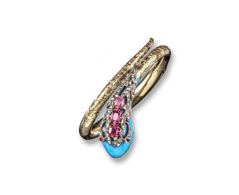 A Victorian gold snake~form hinged bangle, the double~hinged bangle engraved with foliate scroll decoration, the head mounted
