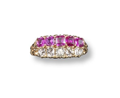 A late Victorian ruby and diamond set gold ring, set with a line of five graduated cushion~shaped diamonds and five graduated