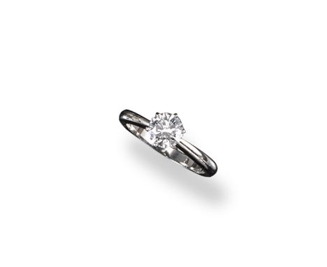 A diamond solitaire ring, the round brilliant cut diamond weighs 0.93cts and is set in platinum. Accompanied by report number