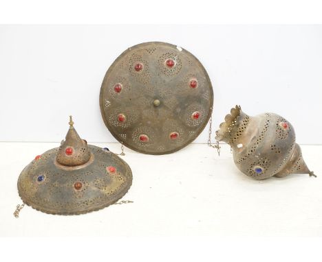 A collection of three North African decorative metal lamp shades. 