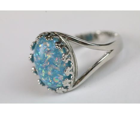 A ladies silver dress ring with central cabochon, marked 925 to the shank.