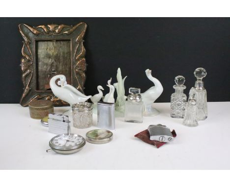 A box of mixed collectables to include LLadro geese, photograph frame, pocket watch, pocket lighters and silver topped bottle