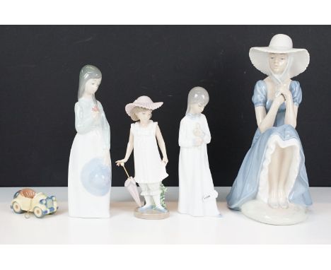 Lladro Nao set of four figurines, one to include girl with pearl handled umbrella numbered 1126 to base together with a small
