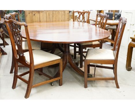 19th Century Regency mahogany twin pedestal dining table with oval top and turned columns raised on brass castors, together w