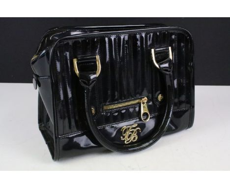 Ted Baker, London, black handbag with gilt metal fittings and a Ted Baker, London, light green wallet (2)