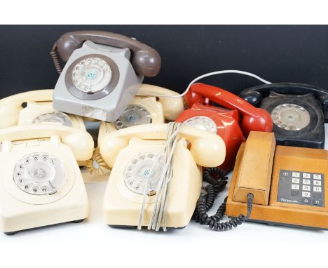 Collection of vintage telephones to include ring dial examples and a telecom brown leather example. 