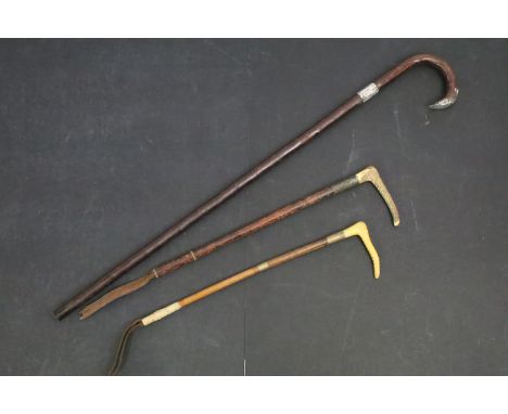Victorian walking stick with silver collar in the form of a buckle and silver cap, London 1899 John Pride together with two v