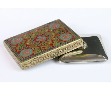 Persian brass and enamel cigarette case with stylised floral decoration together with a white metal compact, the lid with an 