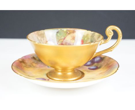 Royal Worcester cup and saucer with gilt and handpainted fruit, cup signed by Moseley, saucer by Bagnall. Saucer 14.5cm diame
