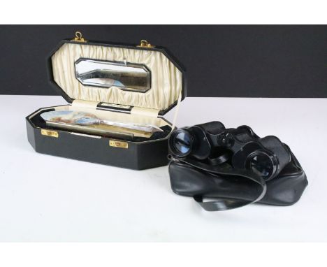 A white metal and enamel brush and comb set within fitted case together with a pair of binoculars. 