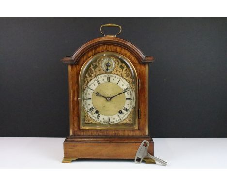 Winterhalder &amp; Hofmeier mahogany cased two train bracket mantel clock, the arched brass dial with silvered chapter ring, 