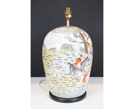 Porcelain table lamp, decorated with huntsmen, horses and hounds, 42cm high, mounted to circular base