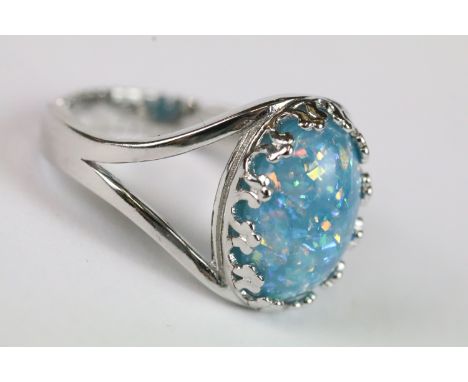 A ladies silver dress ring with central cabochon, marked 925 to the shank.