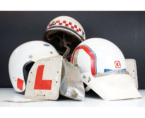 Group of vintage motor cycling helmets to include an Everoak Grand Prix helmet, Kevlar, MG Geno helmet, vintage learner plate