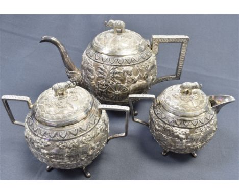 ANTIQUE INDIAN KUTCH SILVER TEA SERVICE circa late 18th century and to include a teapot, approx 15cm tall, milk jug, approx 1