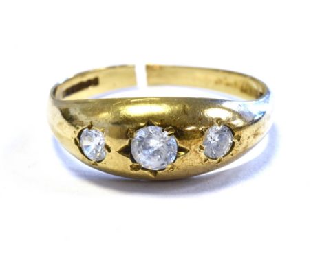9CT GOLD THREE STONE RING gypsy set with three CZ stones, shank is cut, hallmarked 375.  Weight 2.6 grams.