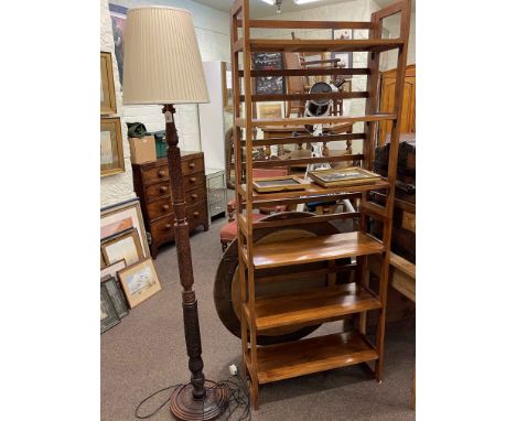 Oriental carved hardwood standard lamp and shade and two folding open bookcases.