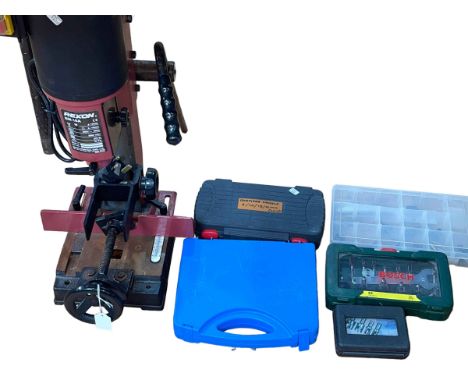 Rexon Router with tools and accessories.