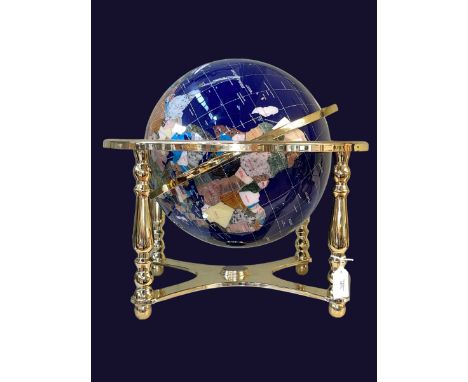 Brass mounted terrestrial globe inlaid with semi-precious gemstones, approximately 40cm high.