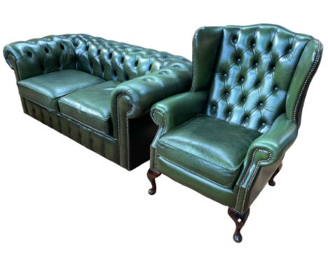 Bottle green buttoned and studded leather two seater Chesterfield settee and wing armchair.