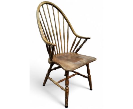 An early 20th century beech stick back Windsor, seat height 45cm