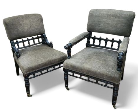 A near pair of Victorian Aesthetic Movement his and hers fireside chairs, ebonised bobbin turned fretwork, tapering turned an