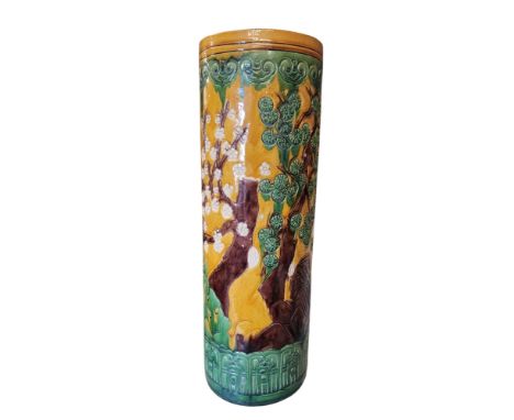 A Chinese Sancai stick stand, decorated with blossoming prunus and pine tree, 64cm high, 20th century