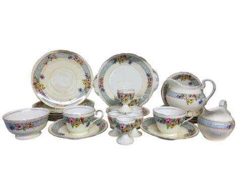 An Aynsley Anemone pattern part tea service, comprising six eggcups, two milk jugs, six dessert plates, two bread and butter 