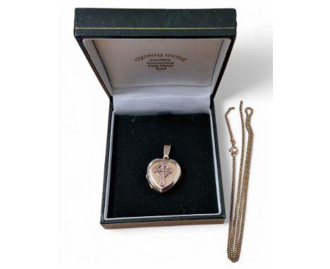 A Welsh 9ct gold heart shaped locket, applied rose gold Celtic cross to cover, HMS, Birmingham, in Cymru-y Metel Presentation