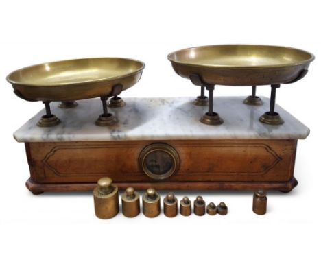 An Italian brass and marble bakers/counter scales, the weighing pans stamped P. Dieci Chilog, marble topped scumbled wooden b