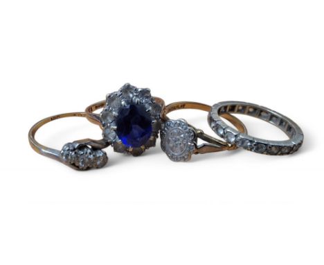 An 18ct gold and diamond trilogy ring, size L1/2, 2g gross; an 18ct gold, platinum and diamond ring, the platinum setting set