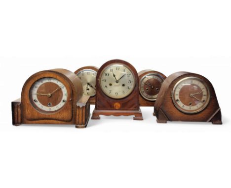 An early 20th century mahogany arched mantel clock, Arabic numerals, twin winding holes, 27cm high, c.1910;&nbsp; others, 193