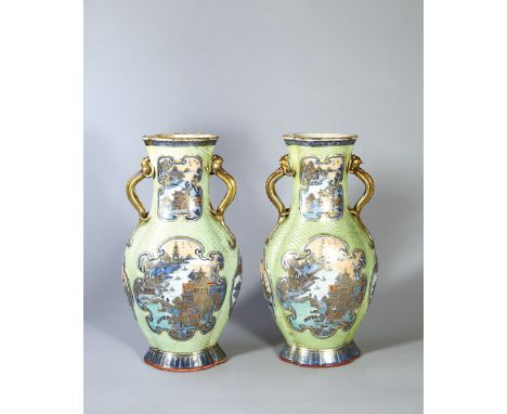 A PAIR OF GREEN-GROUND CANTON ENAMEL AMPHORA VASES, PERIOD OF QIANLONG Size: 35.8 cm (H) Two identical well potted vases with