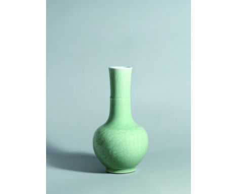 A CELADON-GLAZED PORCELAIN BOTTLE-FORM VASE, PERIOD OF KANGXI Size: 23 cm (H) The vase of bottle form with a globular body an