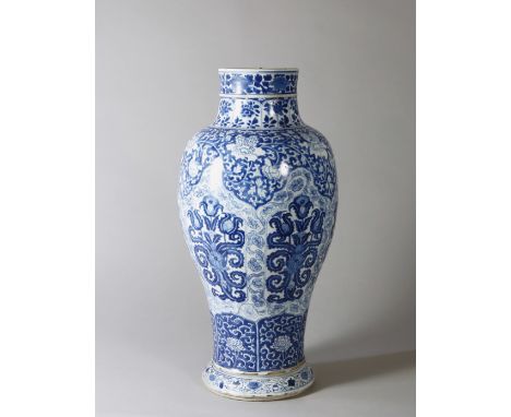 A BLUE AND WHITE ‘RUYI’ GUANYIN BOTTLE, PERIOD OF KANGXI Size: 43.5 cm (H) The rounded sides rising from a spreading foot to 