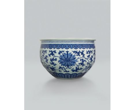 A BLUE AND WHITE 'FLORAL MEDALLION' FISH BASIN, QING DYNASTY Size: 66.8 cm (D) The deep rounded sides rising to an everted ri