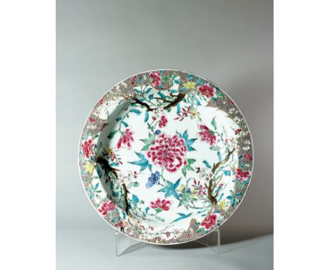 A LARGE ‘FAMILLE ROSE’ BASIN, PERIOD OF YONGZHENG Decorated in bright enamels with a large branch of flowering peony among ot
