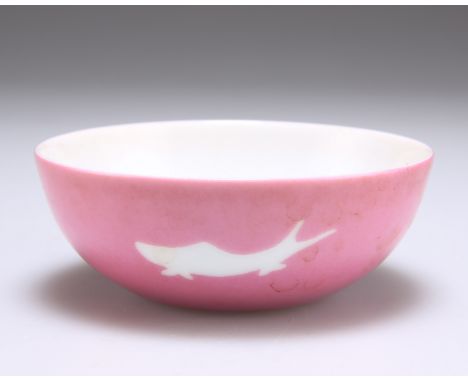 A SMALL CHINESE PORCELAIN SHALLOW BOWL, the well painted with three various flower heads to a white ground, the exterior pink