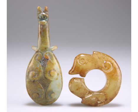 A CHINESE JADE THUMB RING, zoomorphic, 5.5cm; together with A BELT HOOK, 10cm. (2)