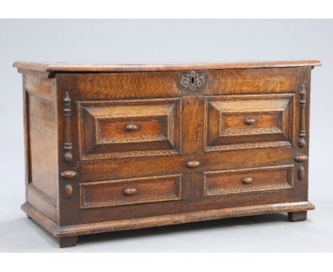 A LATE 17TH CENTURY ELM AND OAK MOULDED-FRONT COFFER, the elm lid over a four panel front flanked by half-round columnar moul