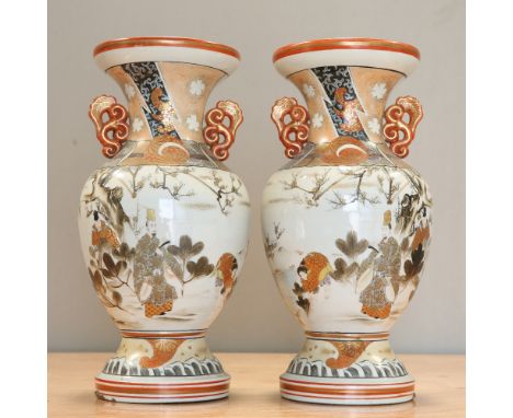 A LARGE PAIR OF JAPANESE KUTANI VASES, CIRCA 1900, of baluster form with twin pierced handles to the neck, each painted in th