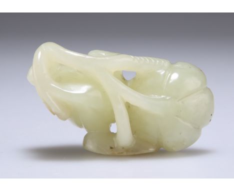 A CHINESE JADE 'LOTUS' CARVING, pierced and carved as two lotus seed pods. 6cm wide