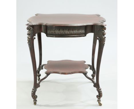 A LATE VICTORIAN MAHOGANY OCCASIONAL TABLE, the moulded shaped square top above a leaf carved frieze raised on foliate capped