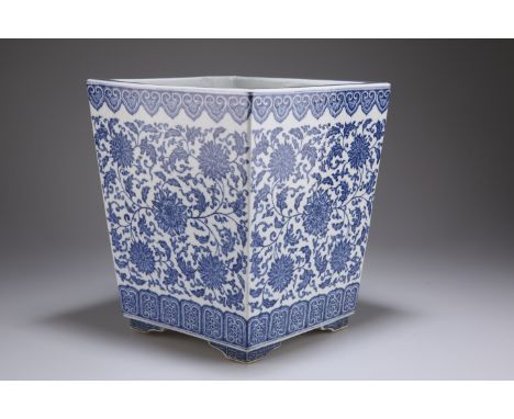 A MING-STYLE CHINESE BLUE AND WHITE PORCELAIN PLANTER, of tapering square form and decorated with a lotus meander and a line 